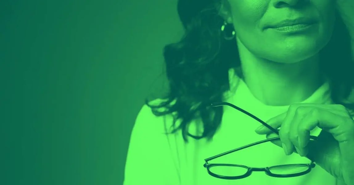 A woman with glasses reviewing a moral dilemma