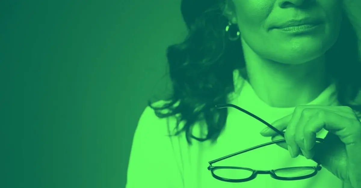 A woman with glasses reviewing a moral dilemma