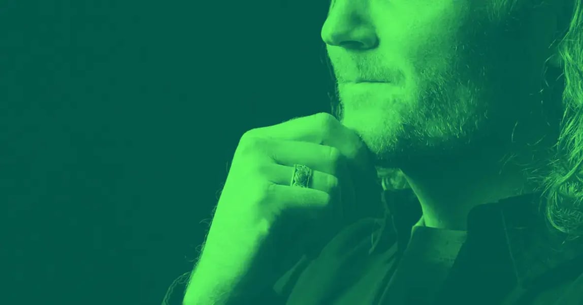 Man with hand on chin