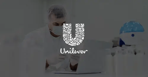 Photo of a man in a lab coat examining a bottle with a white version of the Unilever logo superimposed in the middle foreground