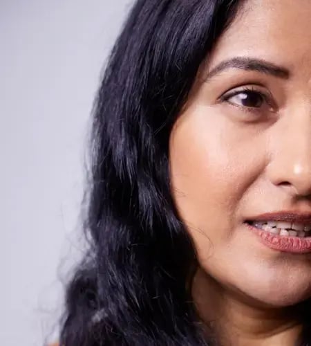 A photo of a woman with dark hair and dark eyes looking forward